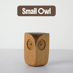 Small Wooden Owl Figurine on a plain background