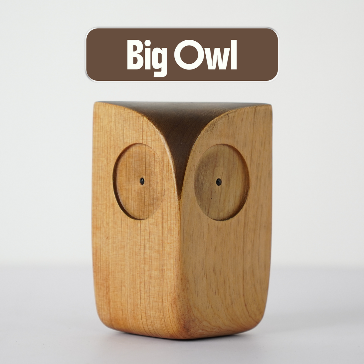 Big Wooden Owl Figurine on a plain background