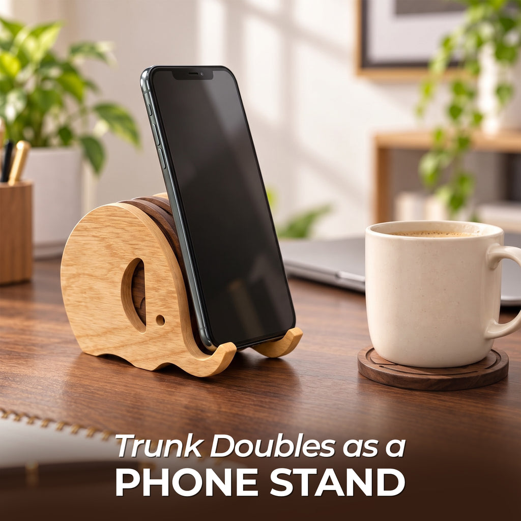 Elephant coaster holder trunk used as a phone stand on a desk