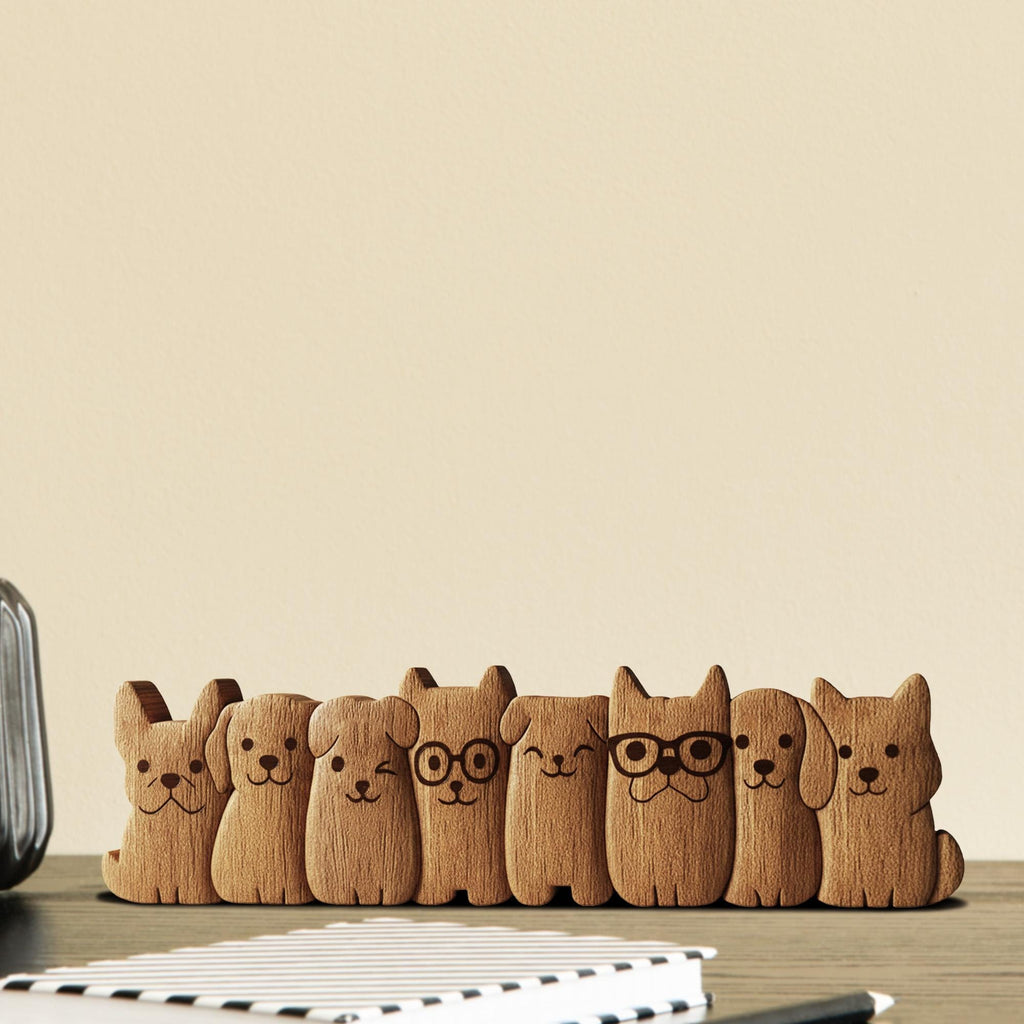Wooden puppy row figurines with varying ear shapes and expressions